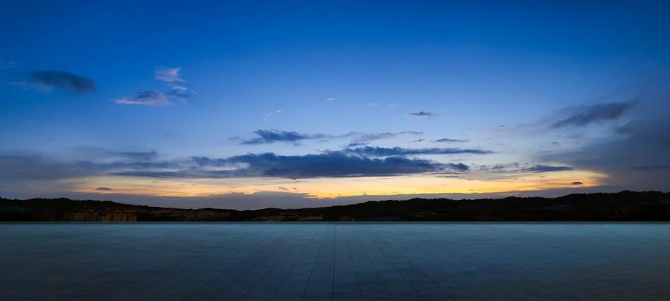 Empty floor with dramatic suset sky Stock Photos