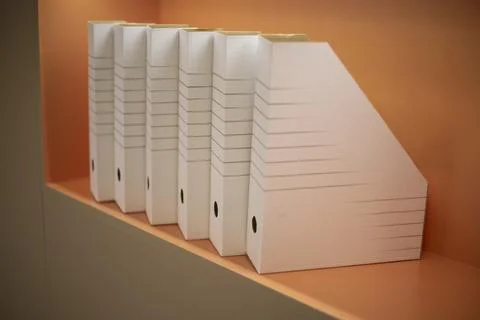 Empty folders stand in a row. A place to store documents. Folders on the shel Stock Photos