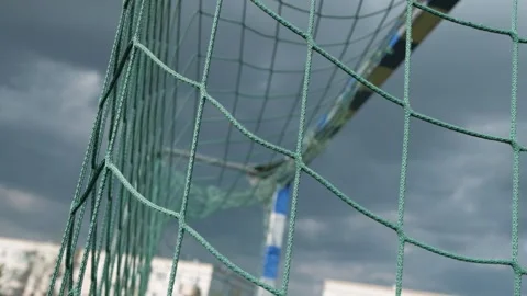 Empty football goal on dramatic sky background. The wind sways the net Stock Footage 131101564