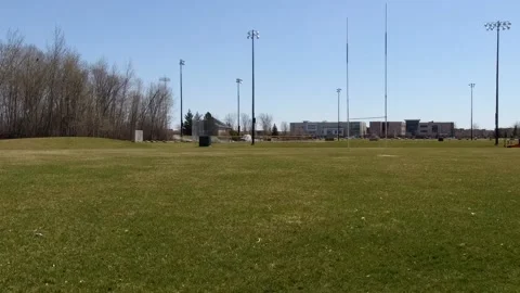 Empty football stand and field. Pan motion Stock Footage 132106989