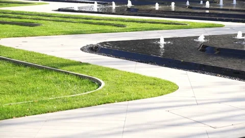 Empty footpath near landscape pool in new residential area Stock Footage 168277921