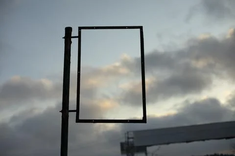 Empty frame against sky. Rectangle black. Picture insertion frame. Stock Photos