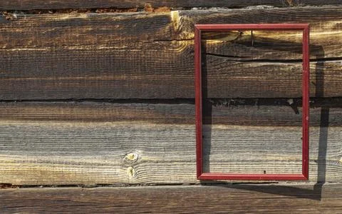 Empty frame on the background of old wood in bright light Stock Photos