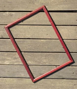 Empty frame on the background of old wood in bright light Stock Photos