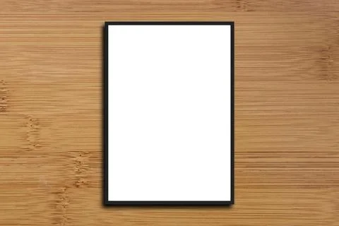 Empty frame. Blank dark grey mounted landscape frame on white wood Stock Photos