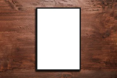 Empty frame. Blank dark grey mounted landscape frame on white wood Stock Photos