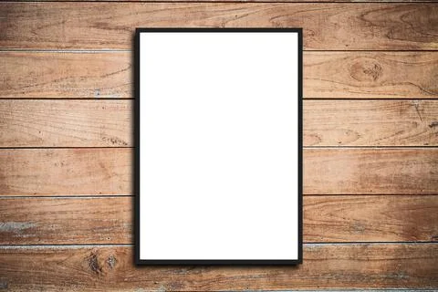 Empty frame. Blank dark grey mounted landscape frame on white wood panel wall Stock Photos
