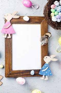 Empty frame with Easter colored eggs around Stock Photos