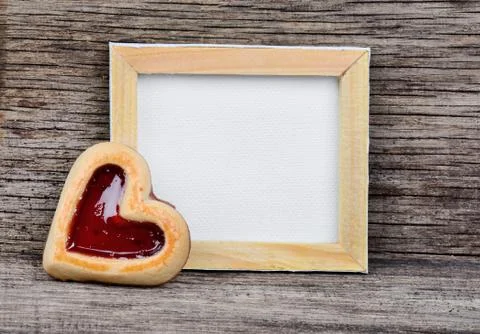 Empty frame with heart cookie Stock Photos