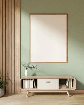 Empty frame over a wooden drawer table with dried branch vase on parquet fl.. Ilustración de archivo