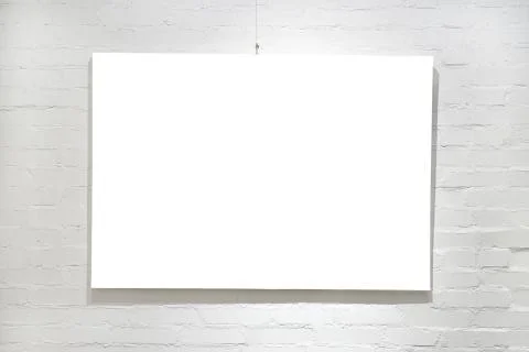 Empty frame on white brick wall Stock-Fotos