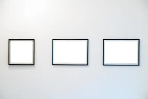 Empty Frames on the wall in modern art museum Gallery Exhibit Stock Photos