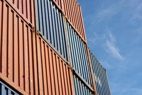 Empty Freight containers stacked high in storage yard Stock Photos