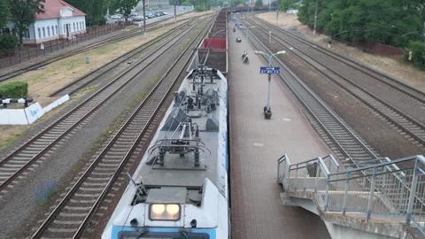 Empty freight train slowly moving Stock Photos