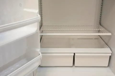 Empty fridge and crisper Stock Photos