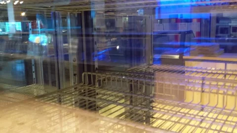 Empty fridge racks on display in mall Stock Footage 146284989