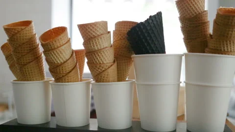 Empty fried waffle cones are stacked in each other. Real time, indoors, contour, Stock Footage 93514503