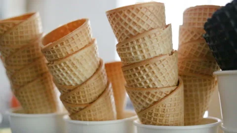 Empty fried waffle cones are stacked in each other. Real time, indoors, contour, Stock Footage 93514574