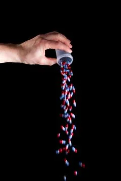 Empty a full container of capsules Foto stock