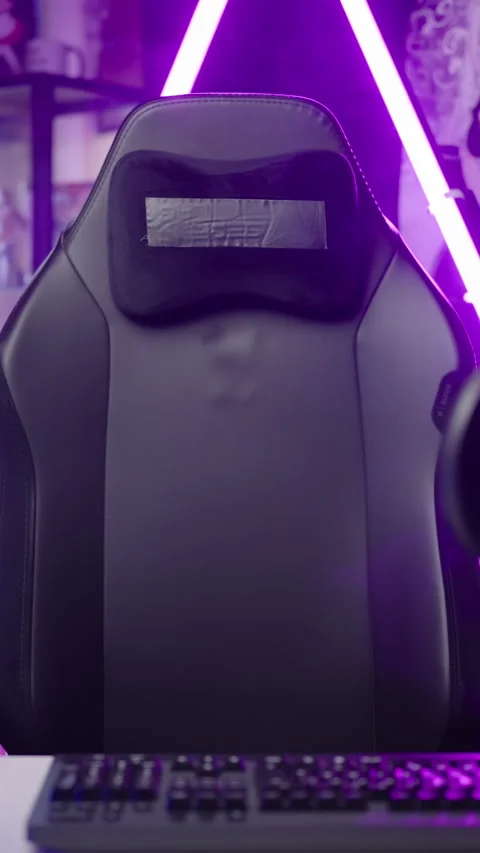 Empty gaming chair moving in anime influencer room pink neon light template Stock Footage 324143120