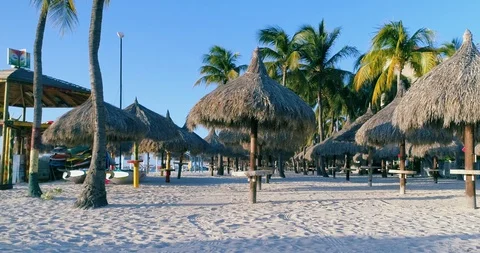 Empty gazebos dolly Caribbean beach, no tourist due to Corona crisis. Stock-Footage 128473113