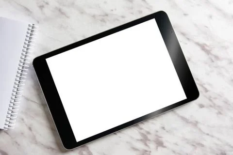 Empty generic tablet pc on top of white marble Stock Photos