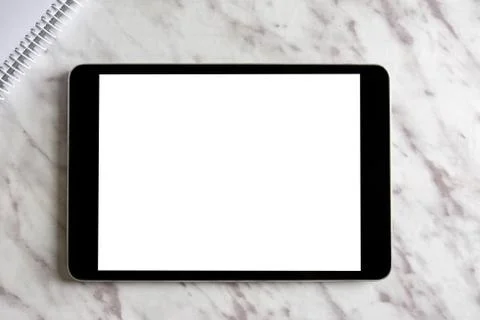 Empty generic tablet pc on top of white marble Stock Photos