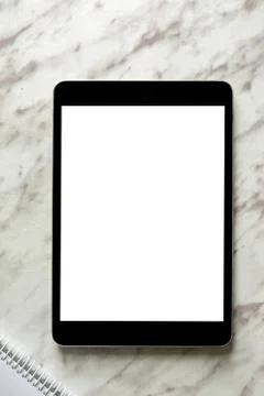 Empty generic tablet pc on top of white marble Stock Photos