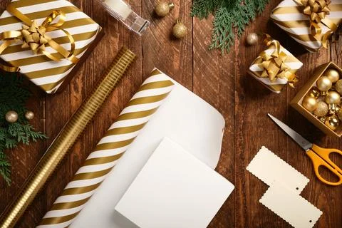 Empty gift box on the table for wrapping gifts. Place for your text. Stock Photos