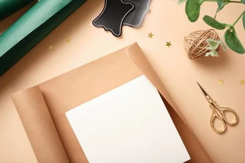 Empty gift box on the table for wrapping gifts. Place for your text. Stock Photos