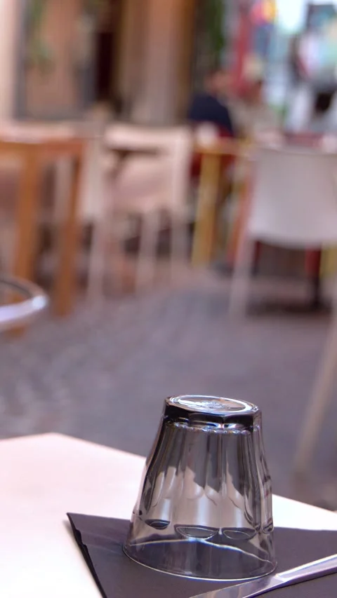 Empty Glass and Table Setting at Outdoor French Bistro Terrace Stock Footage 338319253