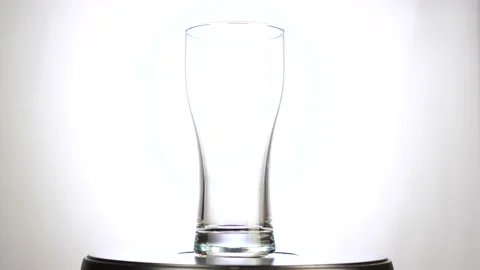 Empty glass beer mug rotating on white background Stock Footage 112679029