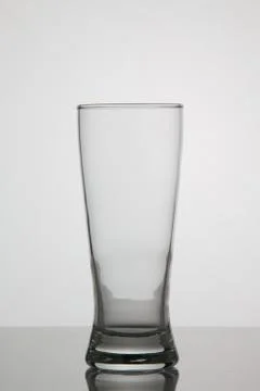 Empty glass of beer on white background Stock Photos