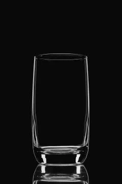 Empty glass on a black background Stock Photos