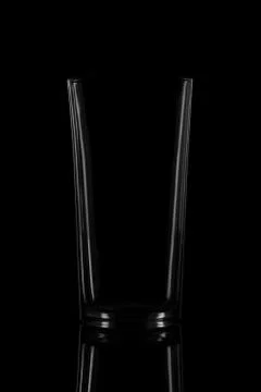 Empty glass on black background with reflection Stock Photos