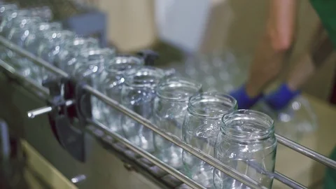 Empty Glass cans on automatic line for processing vegetables. Stock Footage 129263879