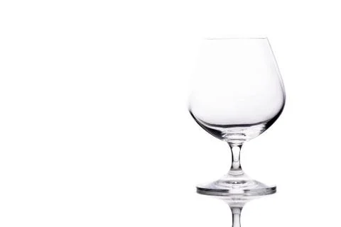 Empty glass of cognac on the table Stock Photos
