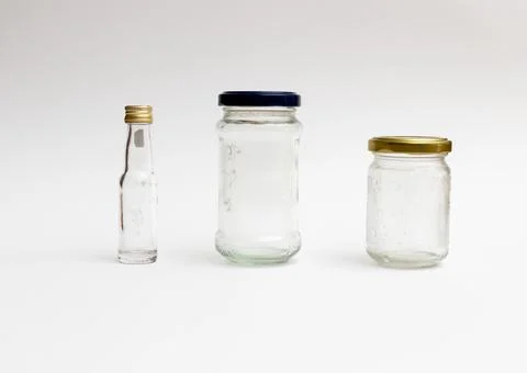 Empty glass containers on white background. Concept of reuse, zero waste and 库存照片