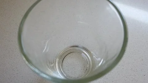 Empty glass cup in a table Stock Footage 282388403