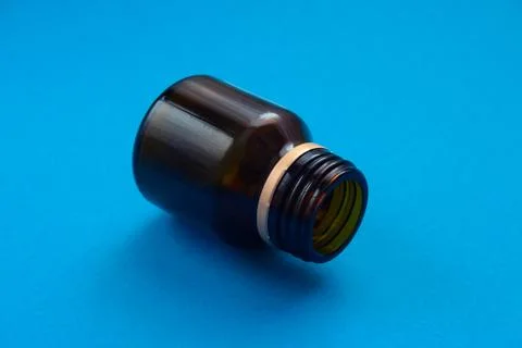 Empty glass dark bottle without pills Stock Photos