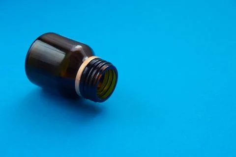 Empty glass dark bottle without pills Stock Photos