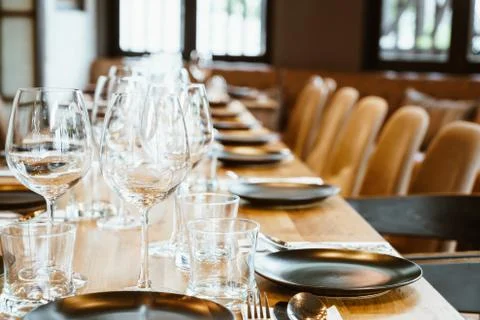 Empty glass on dining table set Stock Photos