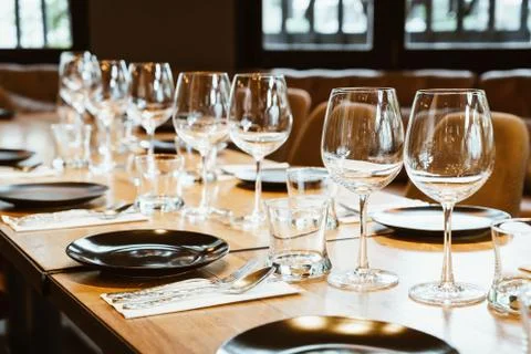 Empty glass on dining table set Stock Photos