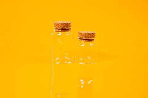 Empty glass empty jar empty ice bucket on orange background Stock Photos