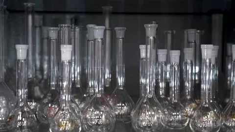 Empty glass flasks. A lot of flasks with lids Stock Footage 252493817
