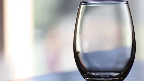 Empty glass that gets filled up Video stock 70475137