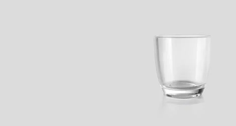 Empty glass isolated on grey background. 3d render Illustrazione stock