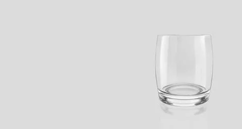 Empty glass isolated on grey background. 3d render Stock Photos
