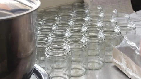 Empty glass jars in the artisanal process of making organic yogurt Stock Photos