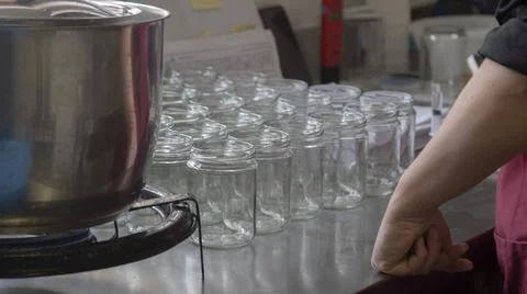 Empty glass jars in the artisanal process of making organic yogurt Stock Photos